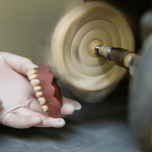 Denture being shaped.
