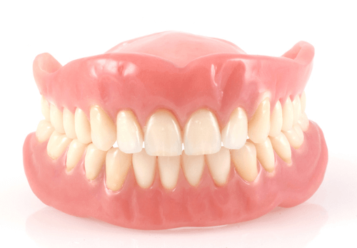 A pair of dentures on a white background.