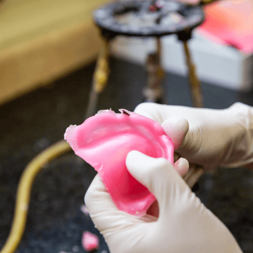Denture mold being created.