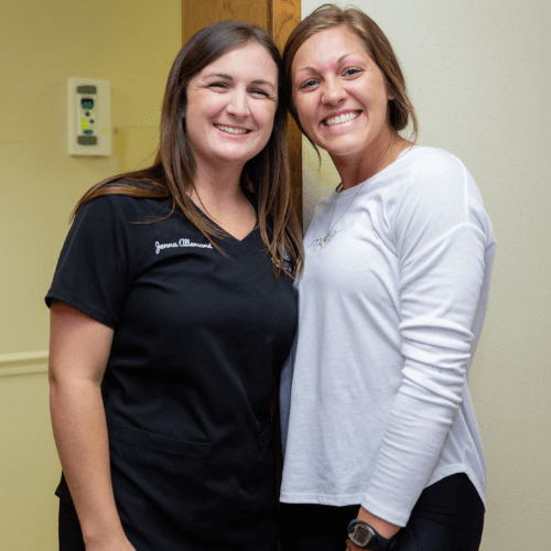 dental assistant and patient smiling for a photo