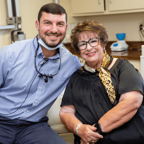 dentist and patient after teeth cleaning