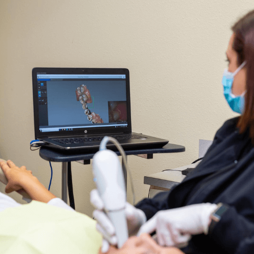 dental assistant taking xrays of teeth