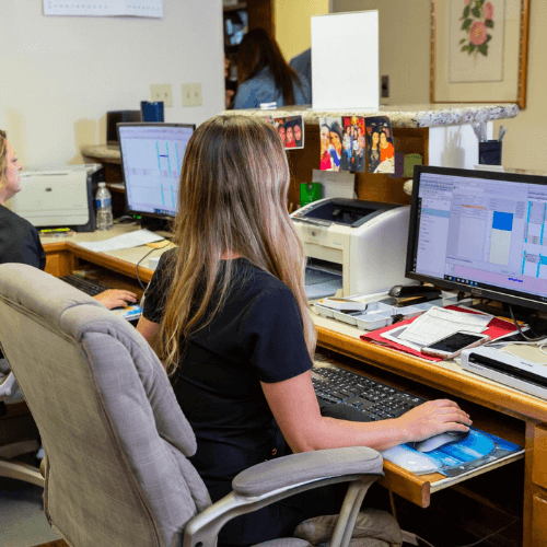 front desk staff working at front desk