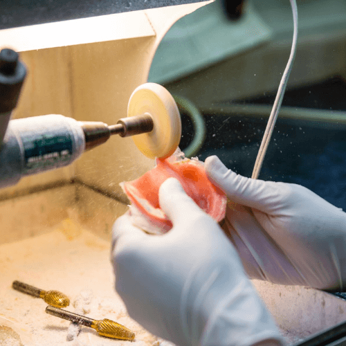 denture mold being shaved down