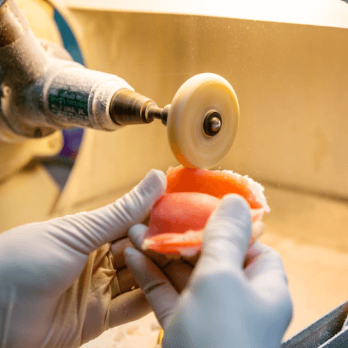 Dentuer tool shaving down denture mold