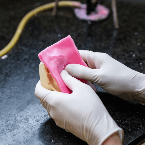 molding denture material onto mold